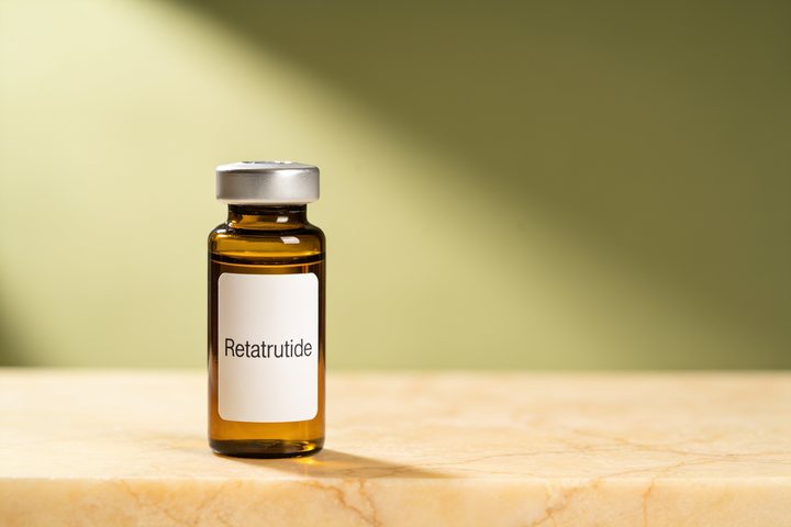 Plain unlabeled laboratory vial on a bare clinical surface, representing a compound Soothe IV does not offer